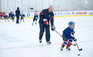 Are there benefits from attending a week-long hockey camp?
